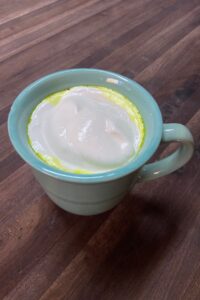 healthy spiced milk topped with whipped cream