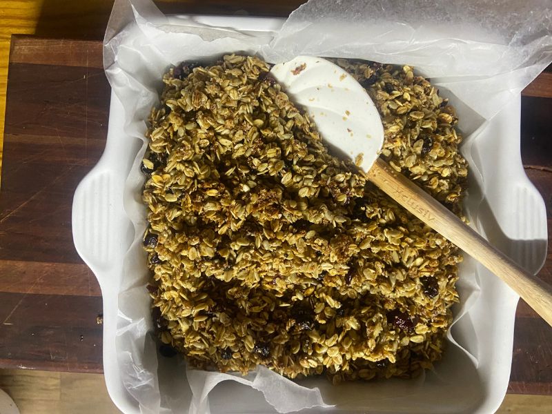 the best granola in only 20 min on the stovetop, finished cooking, scooped out into a dish lined with wax paper