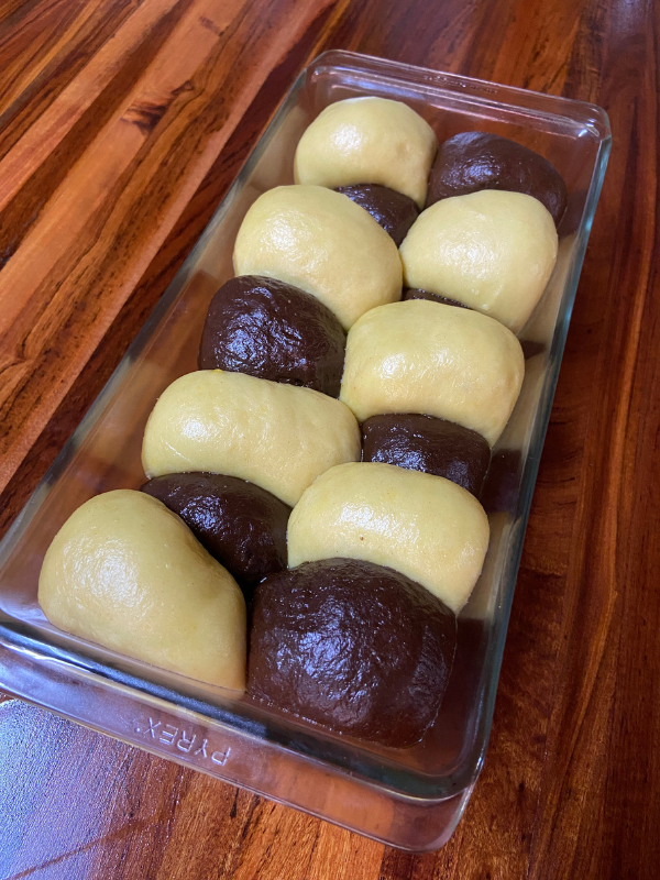 Sourdough Real Life Play Dough For Kids shaped in balls and put in a bread pan